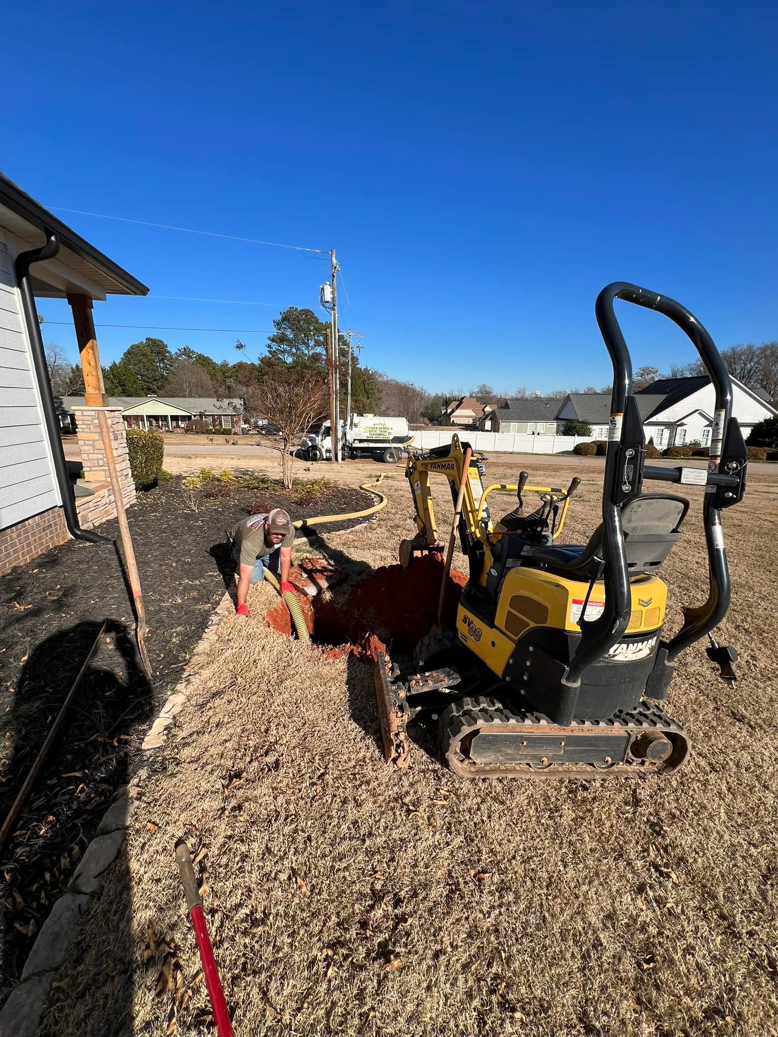 Pump truck and jetter trailer on a septic service job